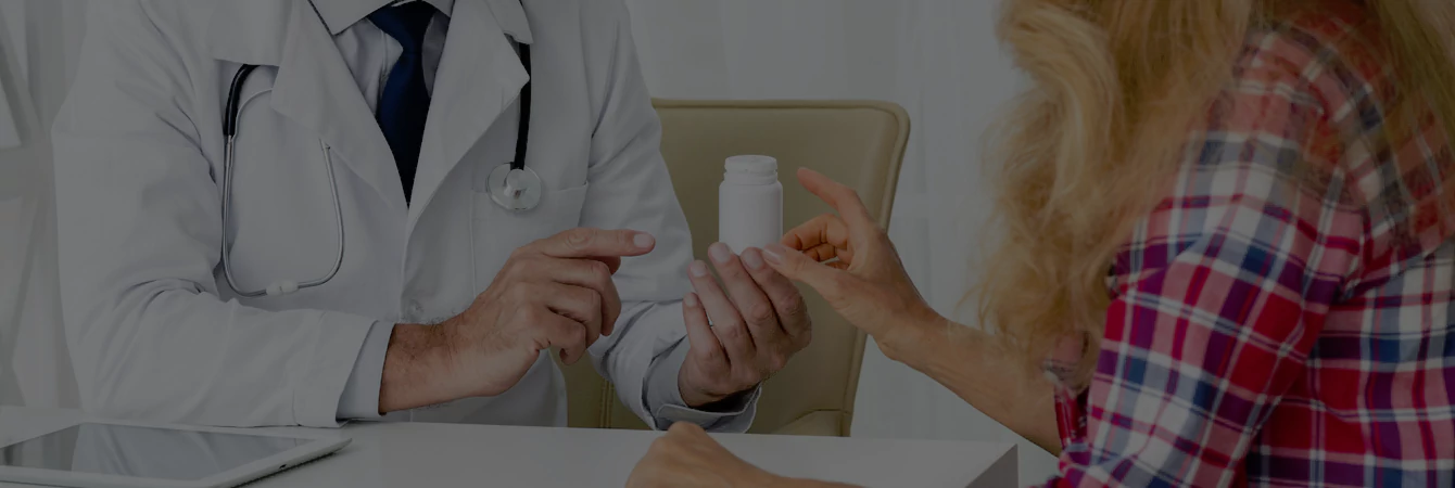 A doctor consults a patient about their pain treatment